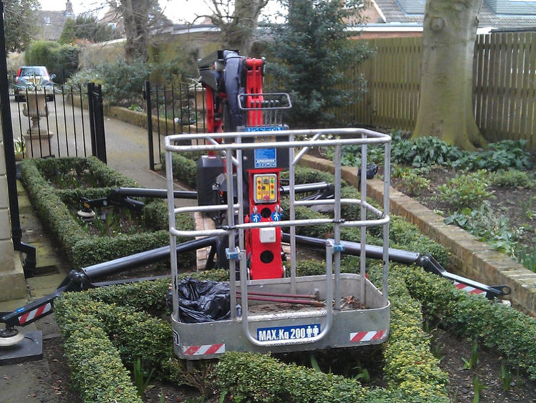 Sophie tracked spiderlift cherrypicker from High Reaching Solutions setting up in restrictive space for building maintenance in York