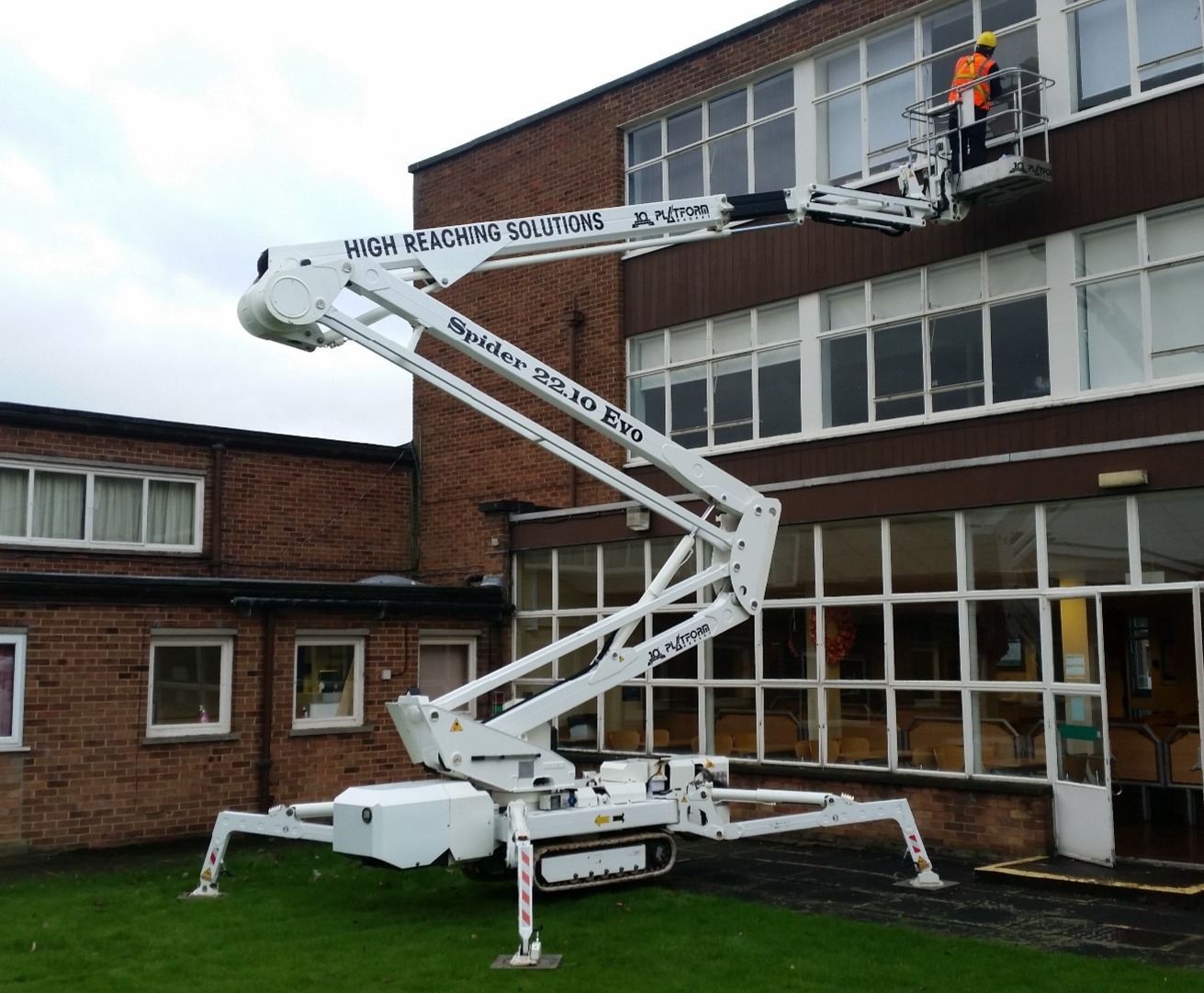 Selina tracked spiderlift set-up and reaching second floor for glazing repairs.
