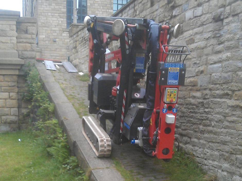 Sophie tracked spiderlift cherrypicker from High Reaching Solutions climbing towpath ramp in Halifax